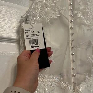 Wedding dress new with tags. Oleg Cassini designer